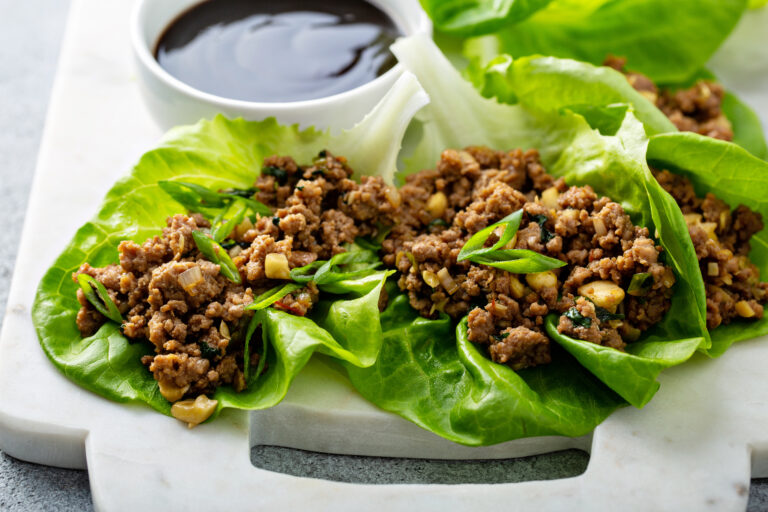 turkey lettuce wraps on white plate