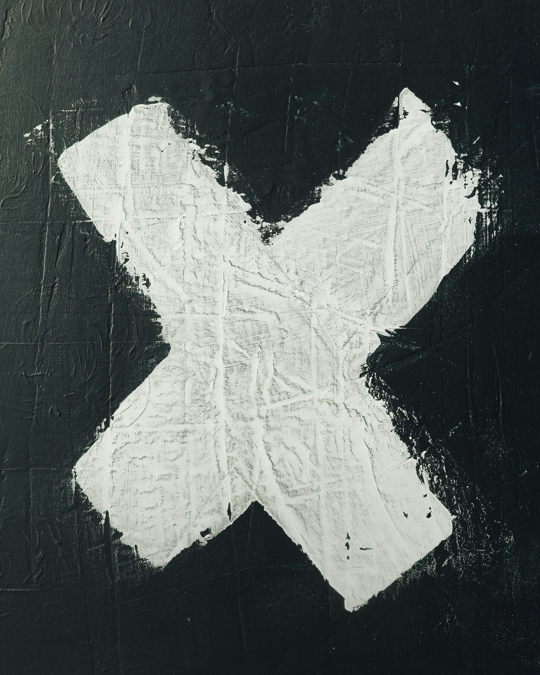 X painted on pavement