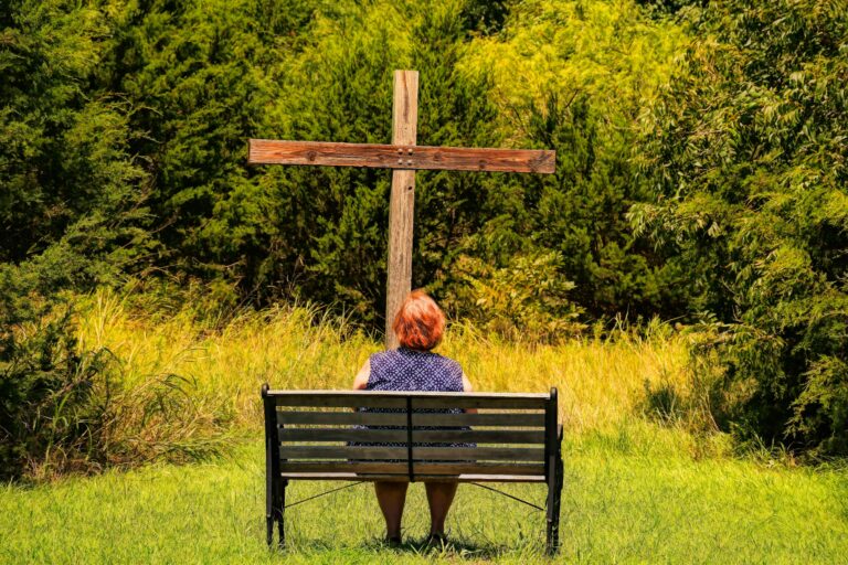 woman looking at cross